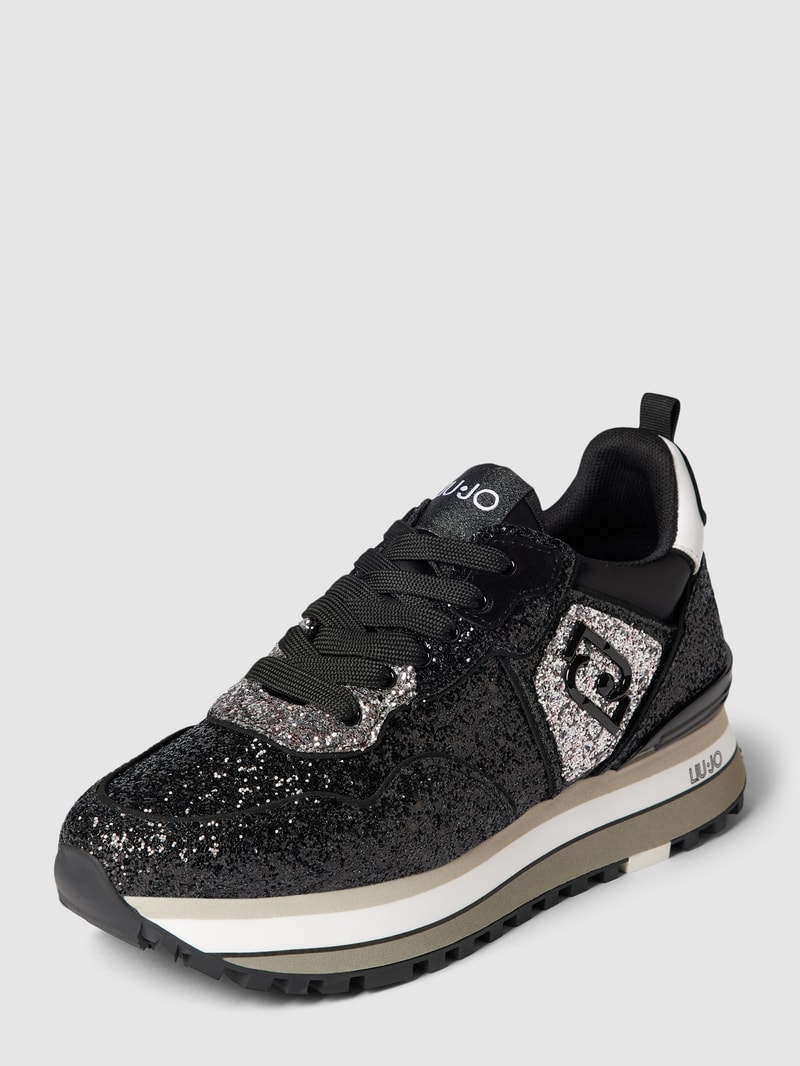 Sneaker mit Zierbesatz in schwarz