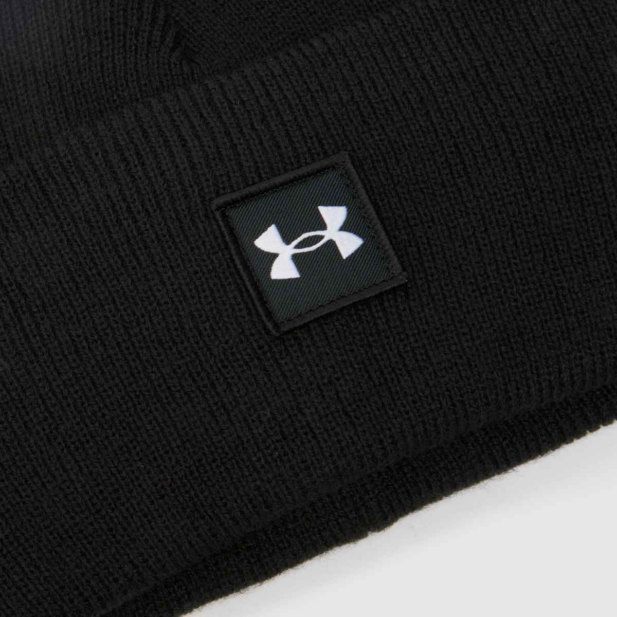 Under Armour svartvit mössa i halvtid