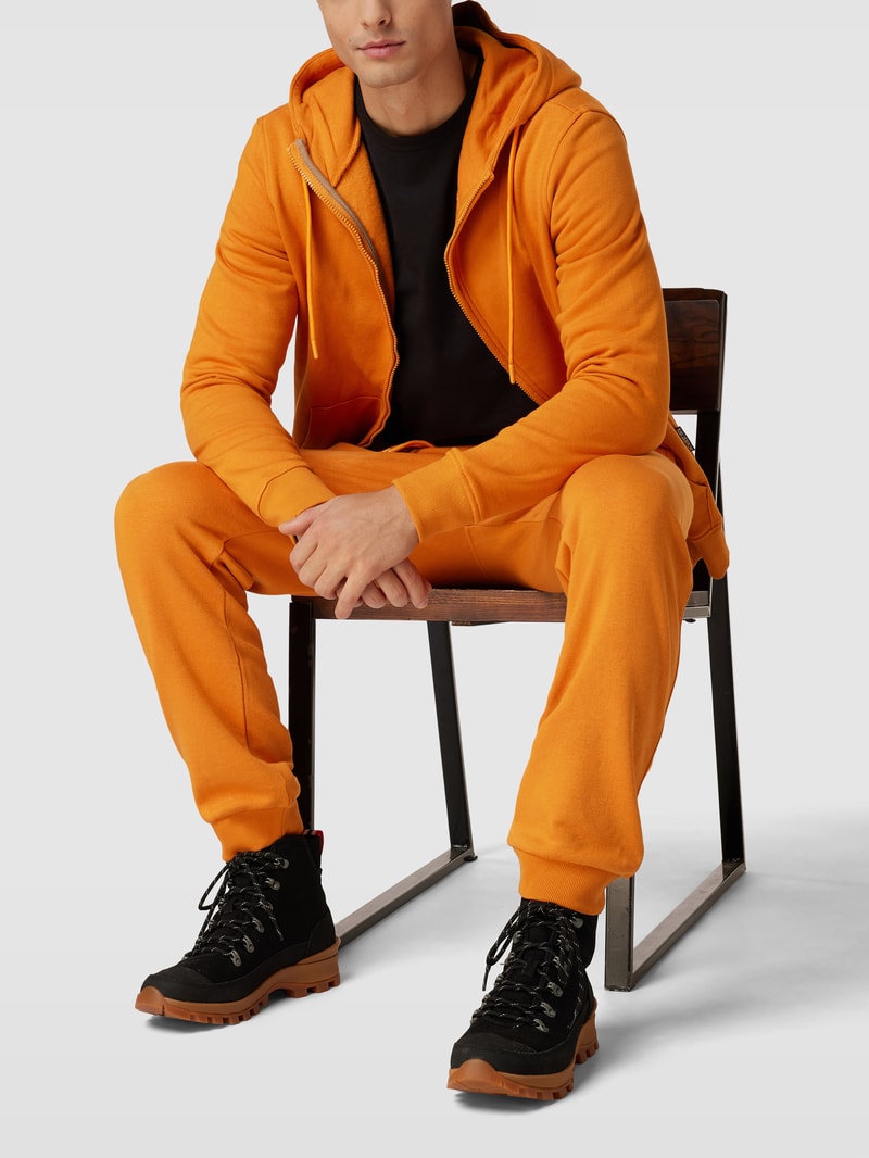 Sweatpants mit Eingrifftaschen in dunkel orange