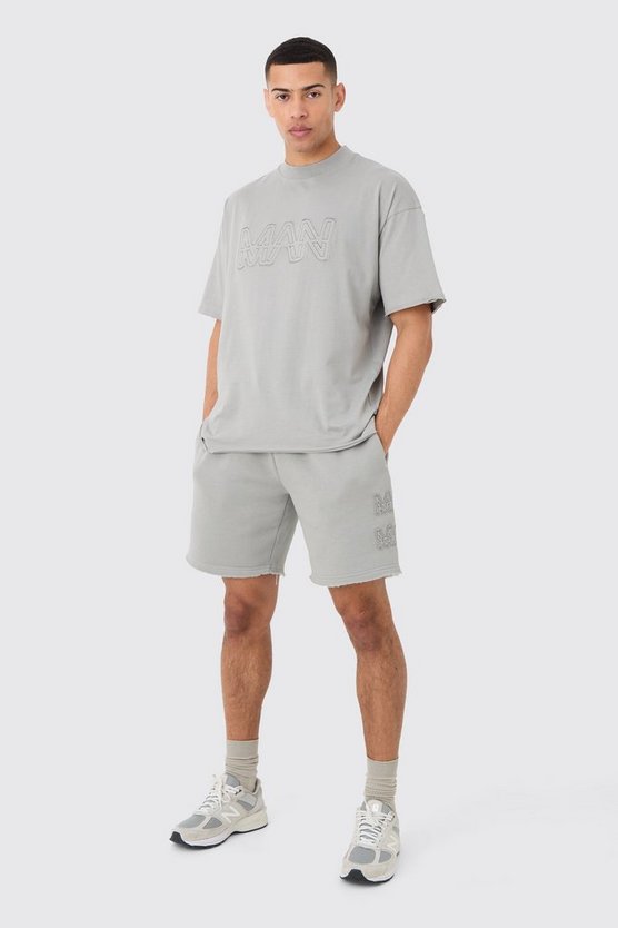 Kastiges zerrissenes Man T-Shirt & Shorts
