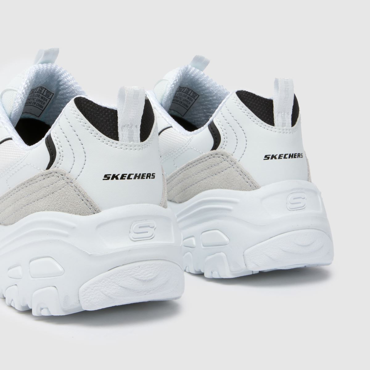 SKECHERS dlites - novi copati za ogrevanje v beli in črni barvi
