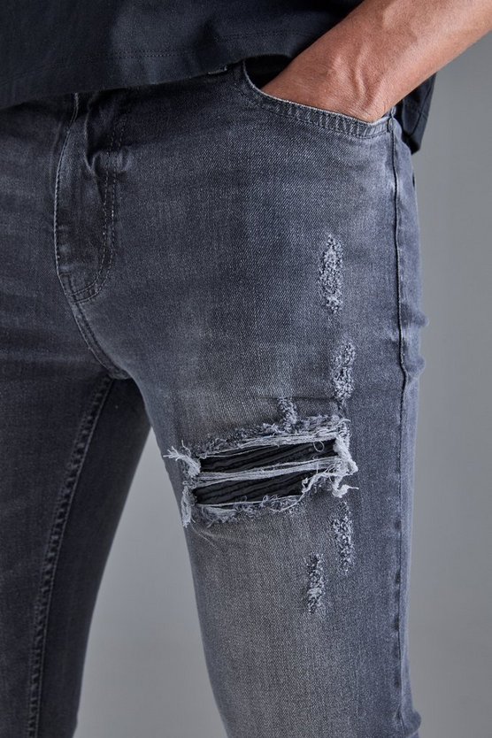 Schwarze Skinny Stretch PU Bikerjeans mit Rissen