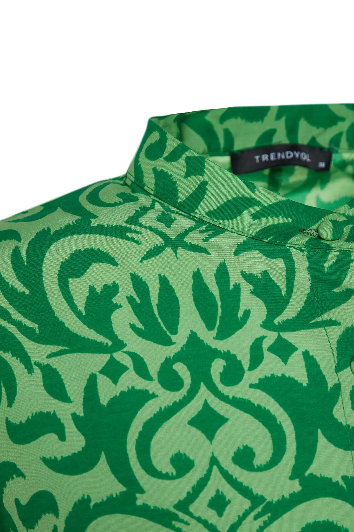 Trendyol Modest  Grünes, gemustertes Kleid aus gewebter Baumwolle mit halber Knopfleiste und weiter Passform TCTSS23EB00222