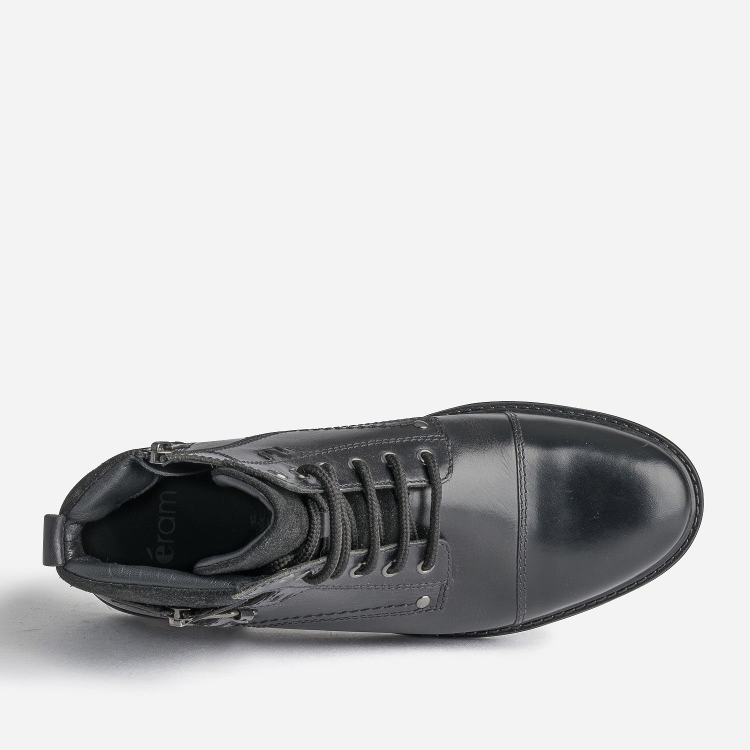 Bottine noire en cuir décor zip et boucle