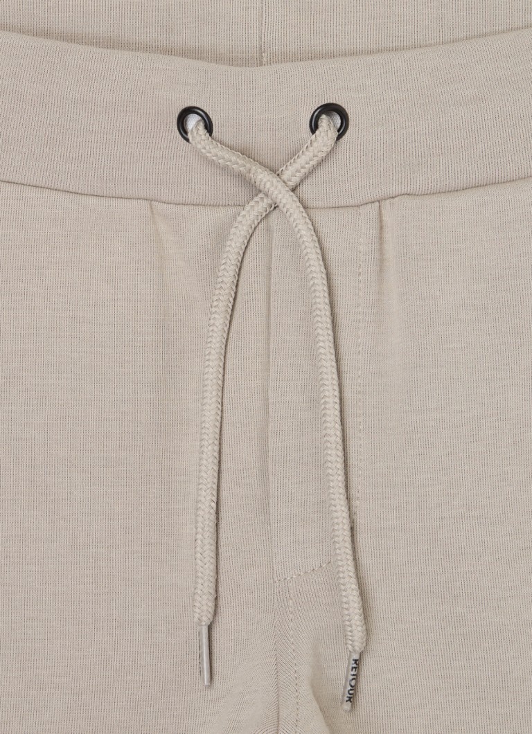 Retour Jeans Kasper -malliset kapenevat collegehousut sivutaskuilla