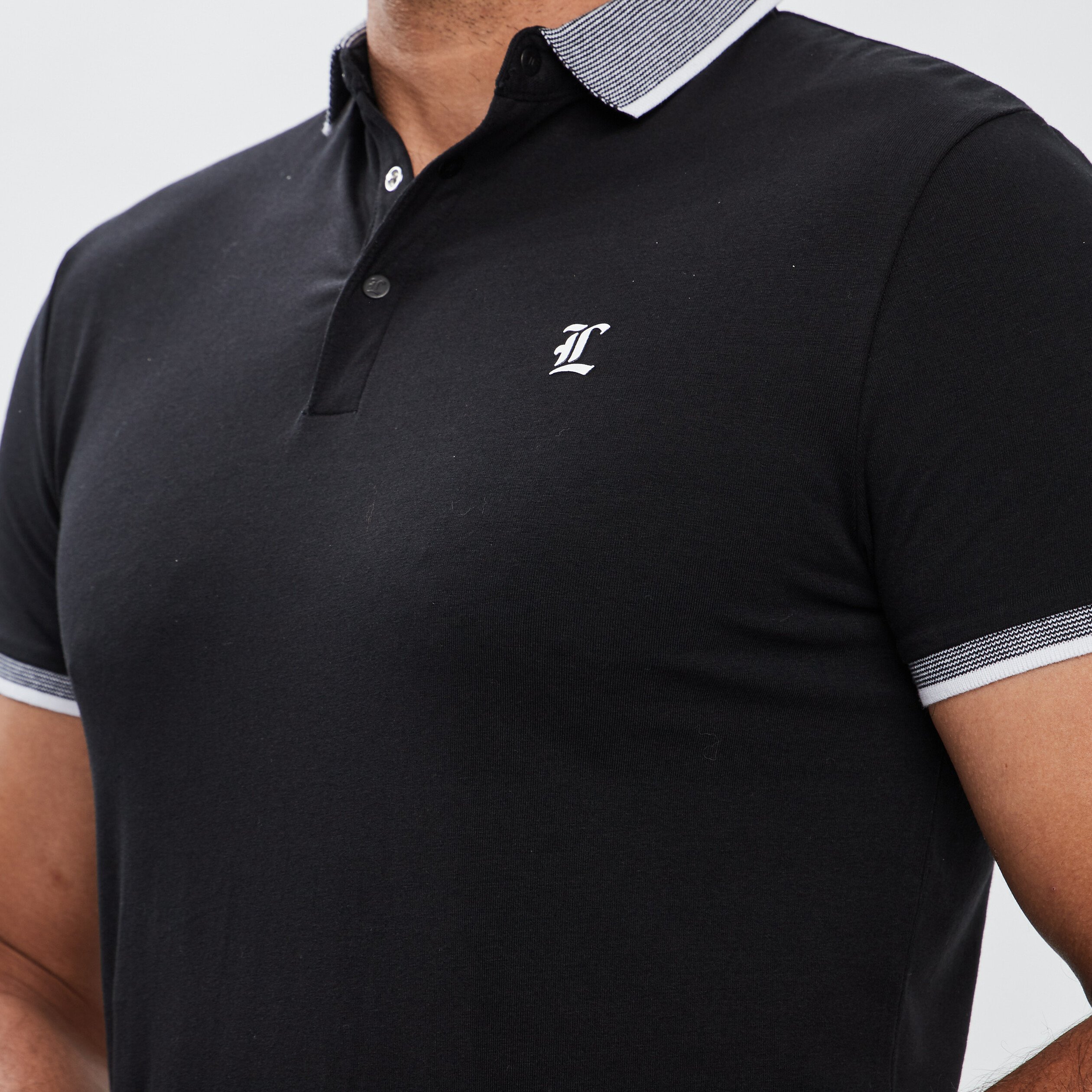 Polo ajusté manches courtes noir homme | La Halle