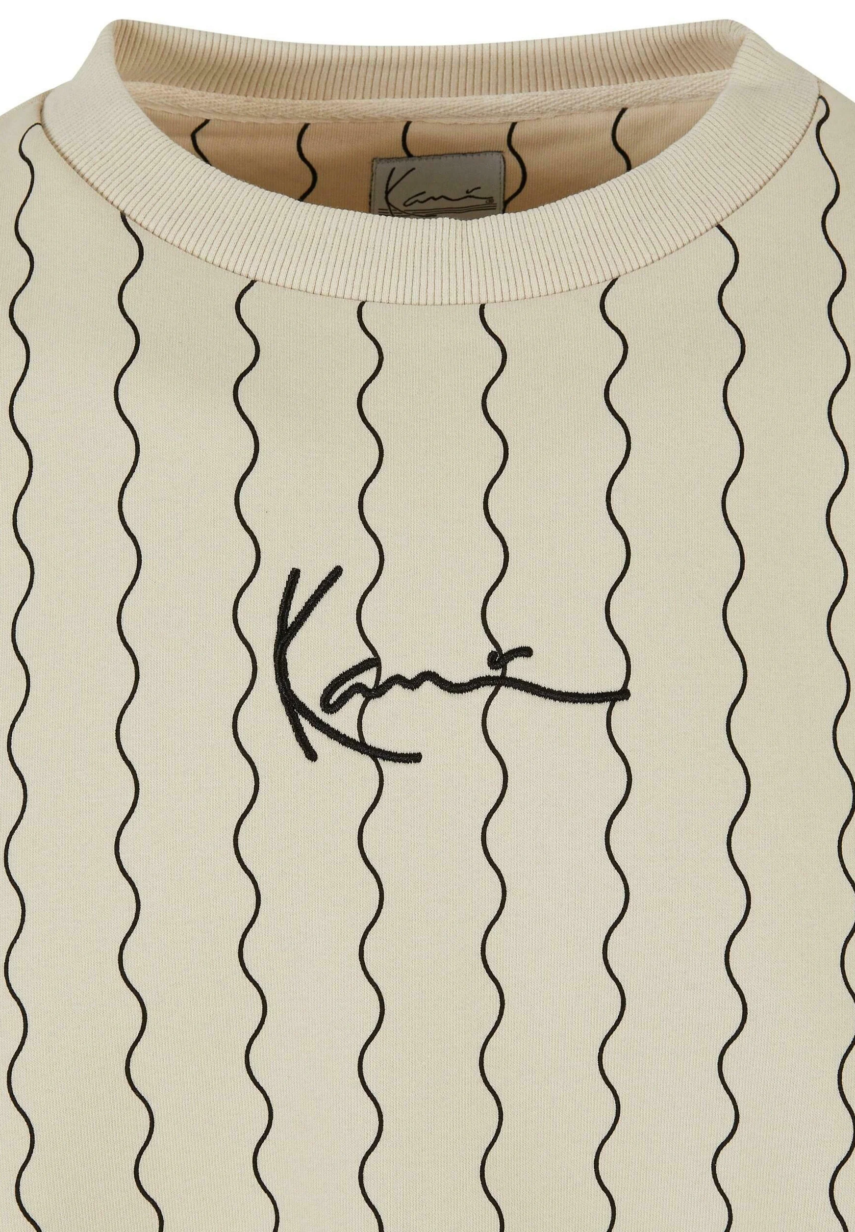 Sudadera Karl Kani con cuello redondo, rayas ziczac y firma pequeña