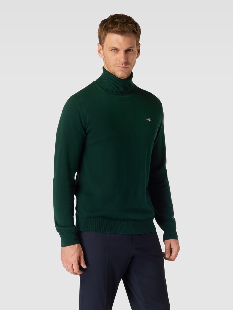 Rollkragenpullover mit Label-Stitching aus Baumwoll-Woll-Mix in dunkelgrün