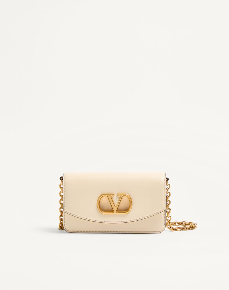 Clutch Vain da Valentino Garavani em couro de bezerro brilhante