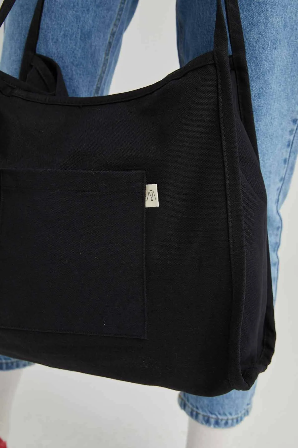 Manuka  Schwarze Canvas-Umhängetasche für Damen