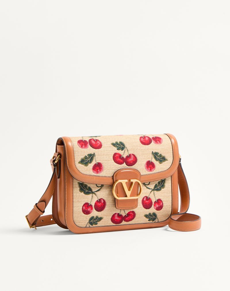 Bolsa de ombro Valentino Garavani 9To5 em ráfia jacquard com estampa de cerejas.