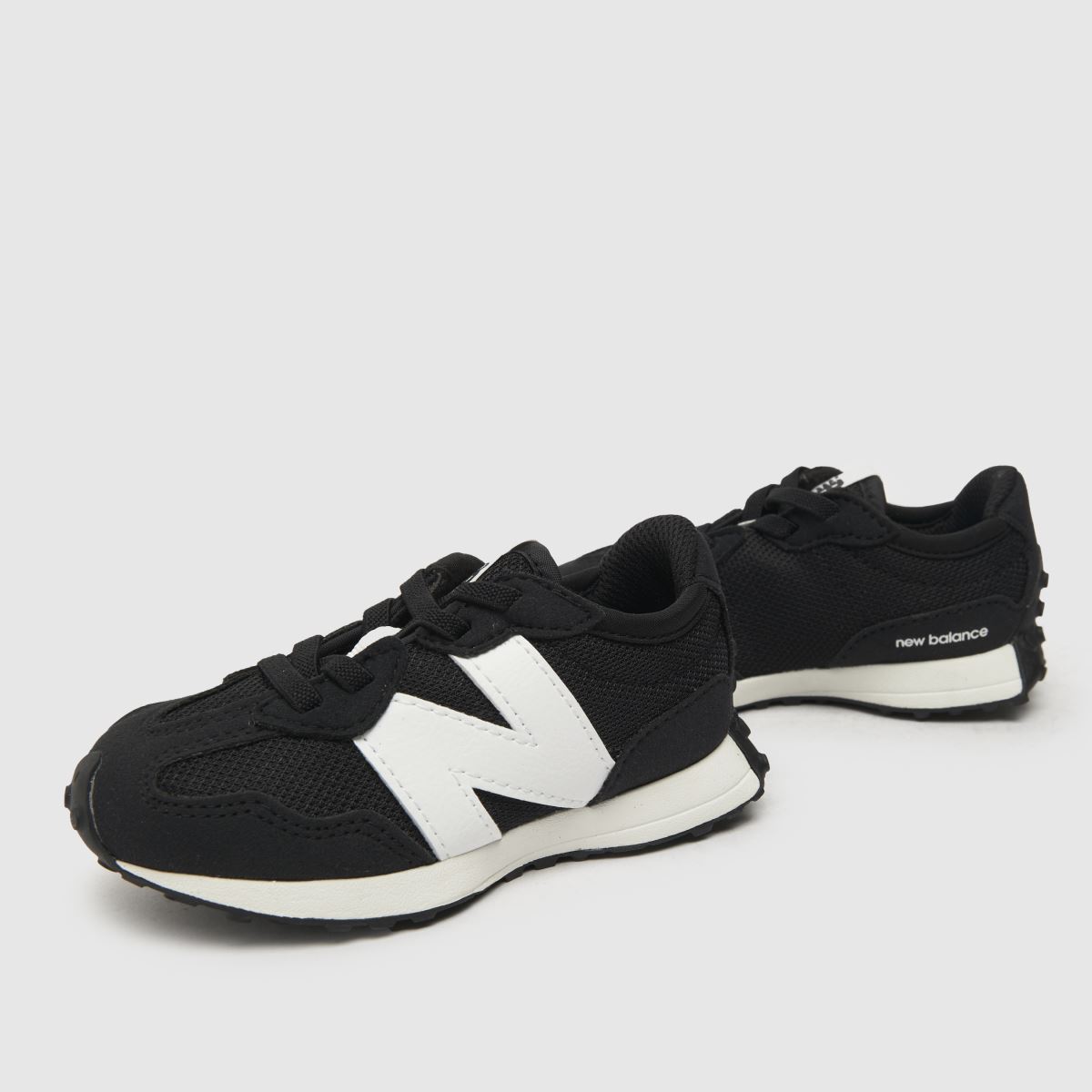 New Balance svarta och vita 327 småbarnsskor