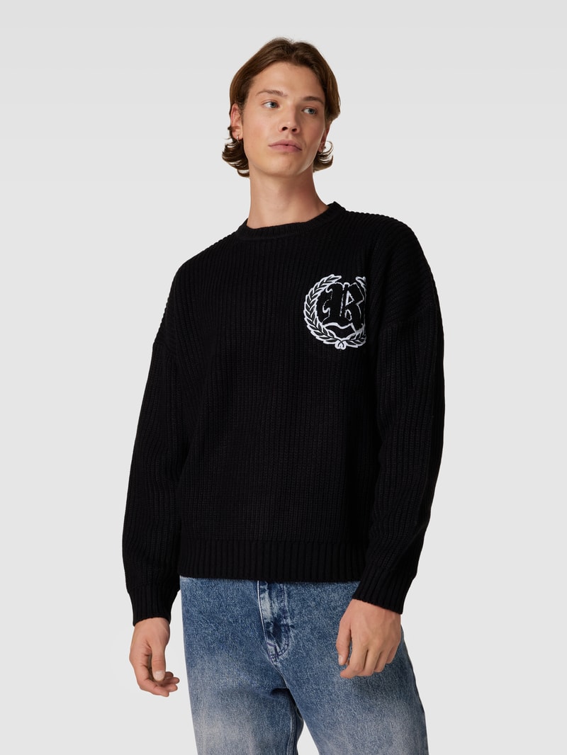 Strickpullover mit überschnittenen Schultern in schwarz