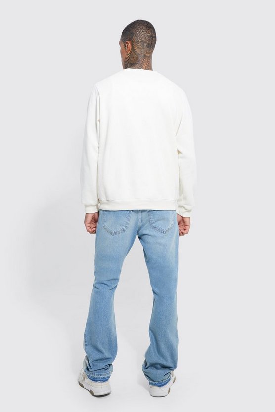 Slim-Fit Schlagjeans mit Applikation