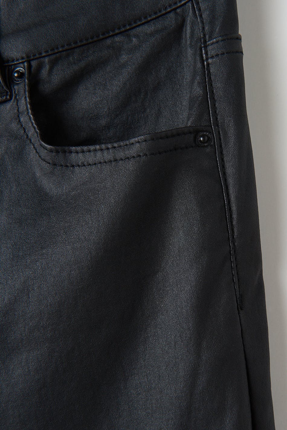 Coated bootcut jeans