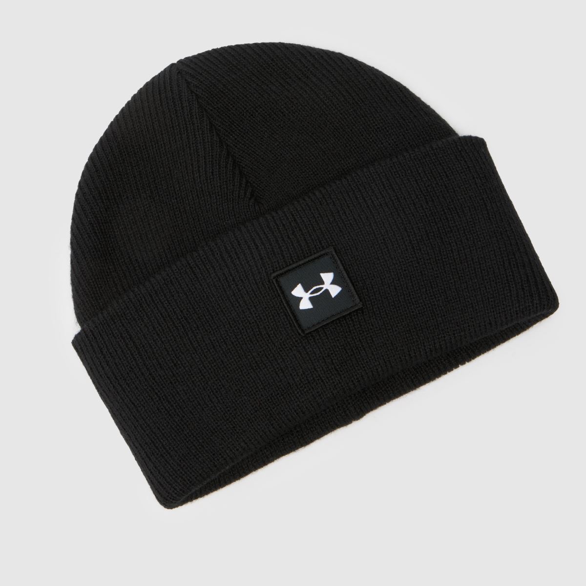 Under Armour svartvit mössa i halvtid