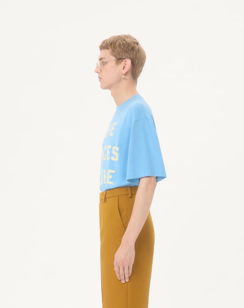 Valentino katoenen T-shirt met print 'Love Dances On The Abyss' en 'Made In Valentino'.