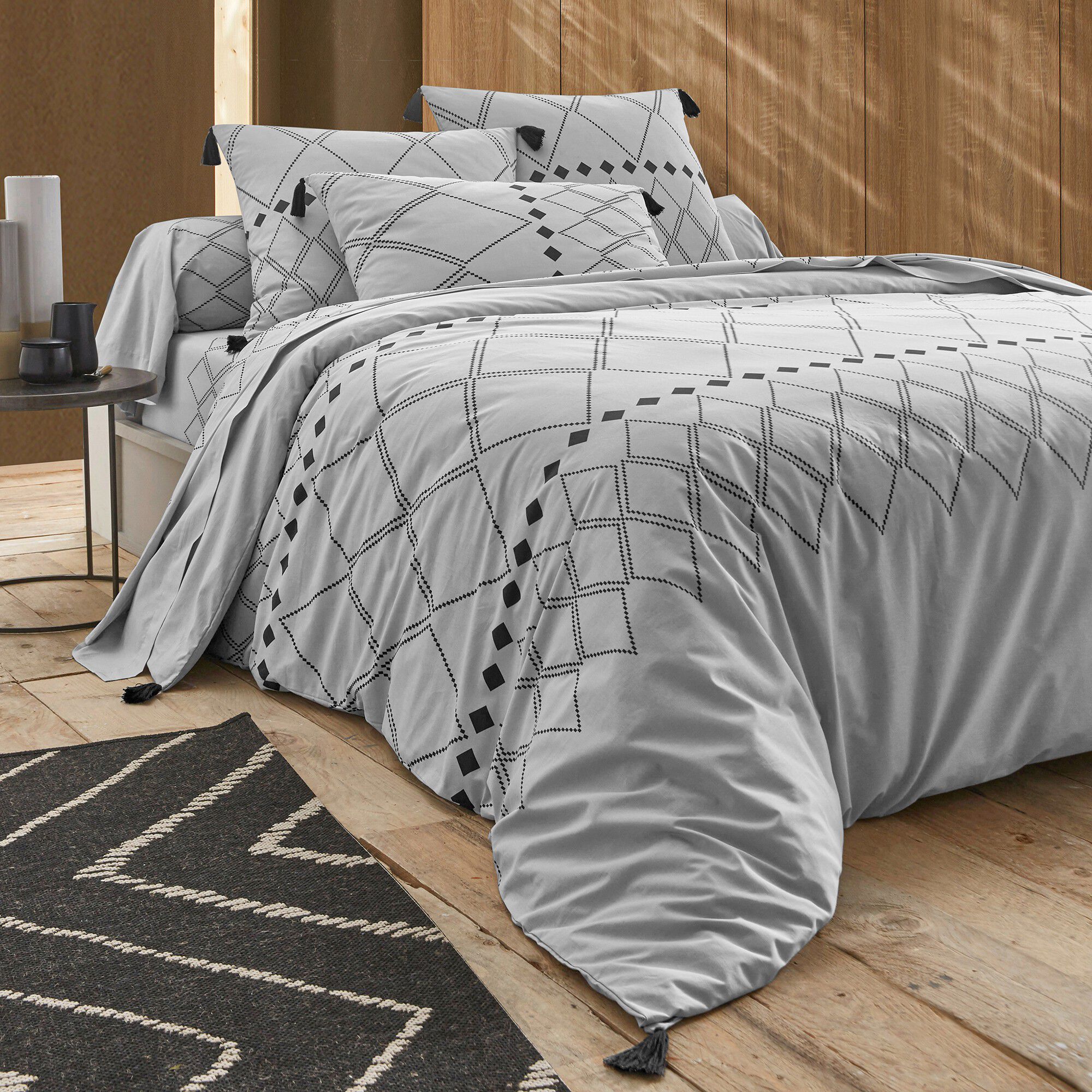 Linge de lit Massaï coton à motifs graphiques et finitions pompons