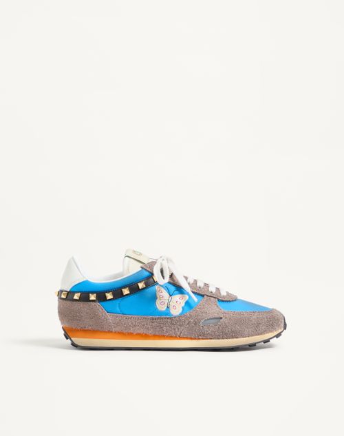 Baskets cloutées en cuir fendu et nylon avec broderie papillon