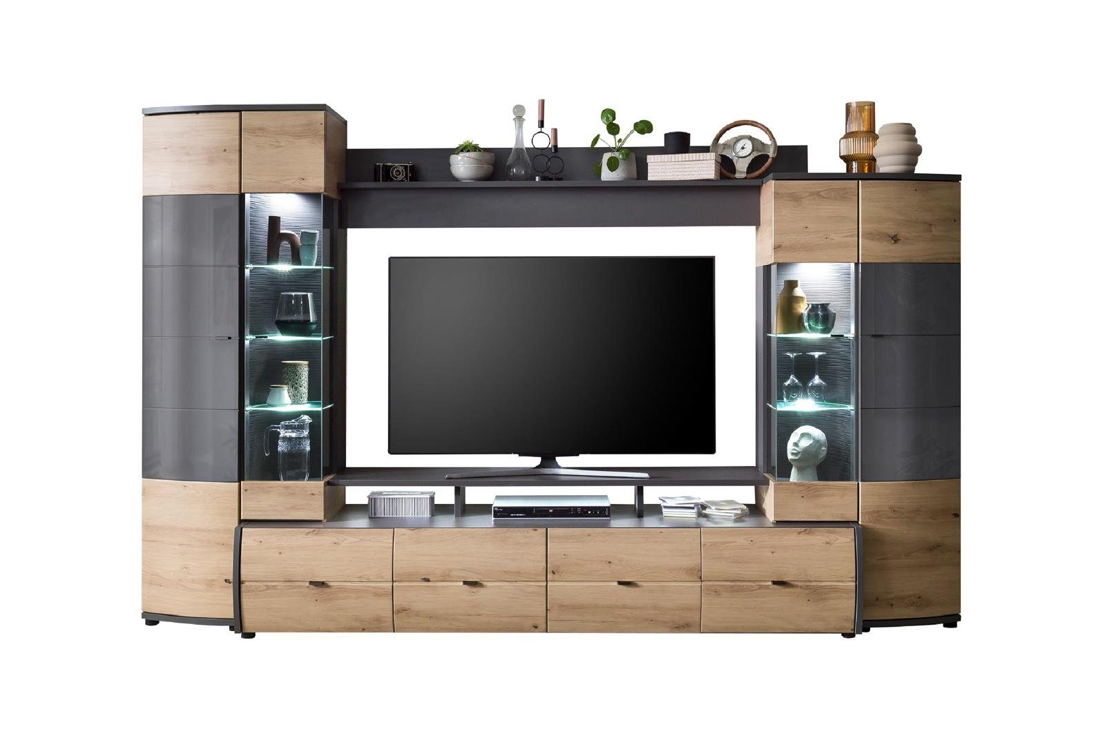 möbelando Wohnwand Flori, Moderne Wohnwand, Front aus MDF in Artisan-Eiche / Anthrazit mit Glasabsetzung, Korpus aus melaminharzbeschichteter Spanplatte in Anthrazit / Artisan-Eiche, mit 1 TV-Lowboard, 1 Wandboard, 2 Vitrinen, mit 4 Türen, 4 Schubkäs