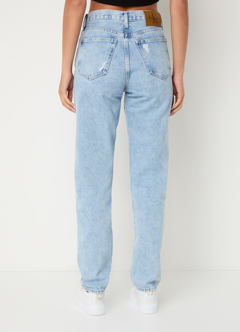 Calvin Klein high-waist slim-fit jeans with a light wash and destroyed finish