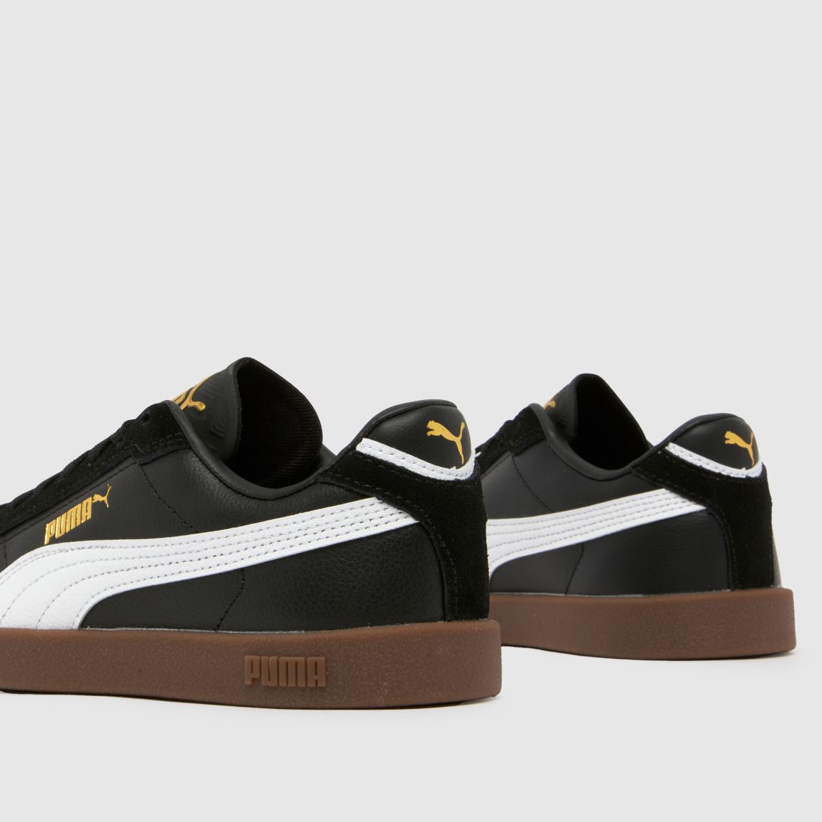 PUMA svarta och vita Club II Era ungdomsskor
