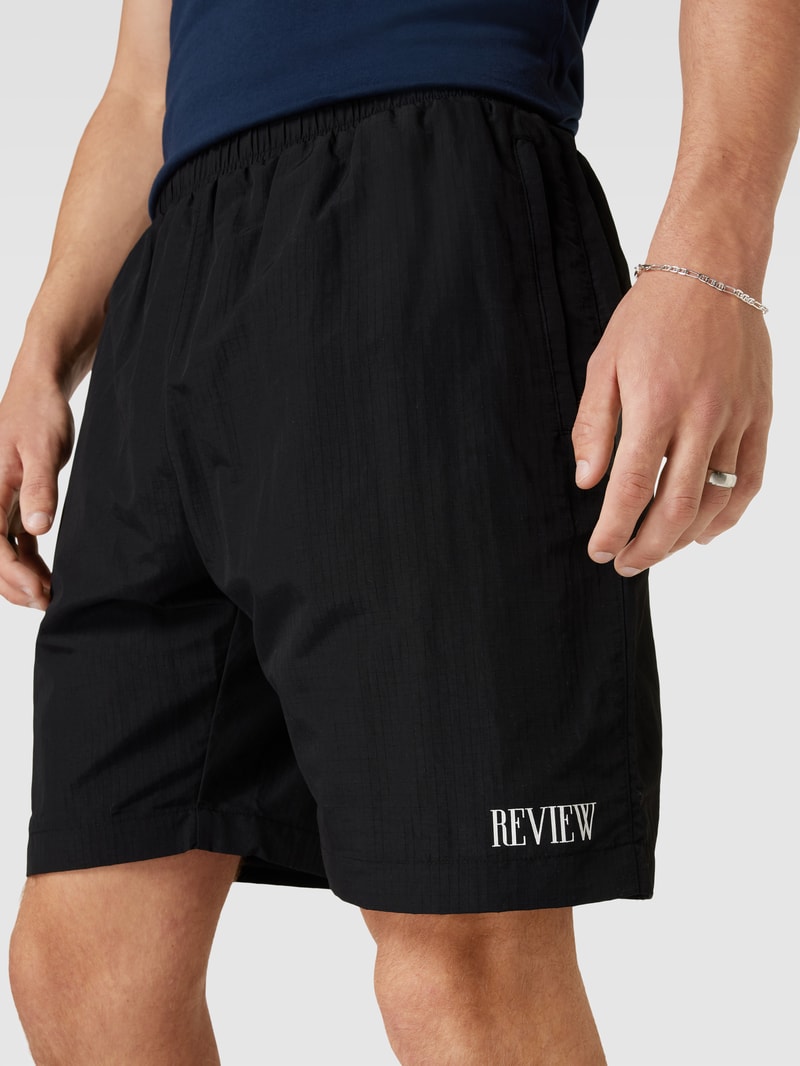 Shorts mit Label-Print in schwarz