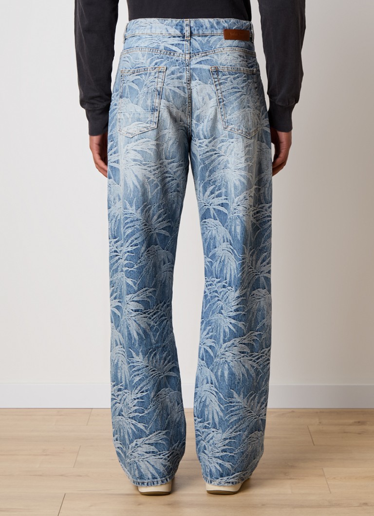 Blugi cu croială largă de la Palm Angels, cu imprimeu tropical.