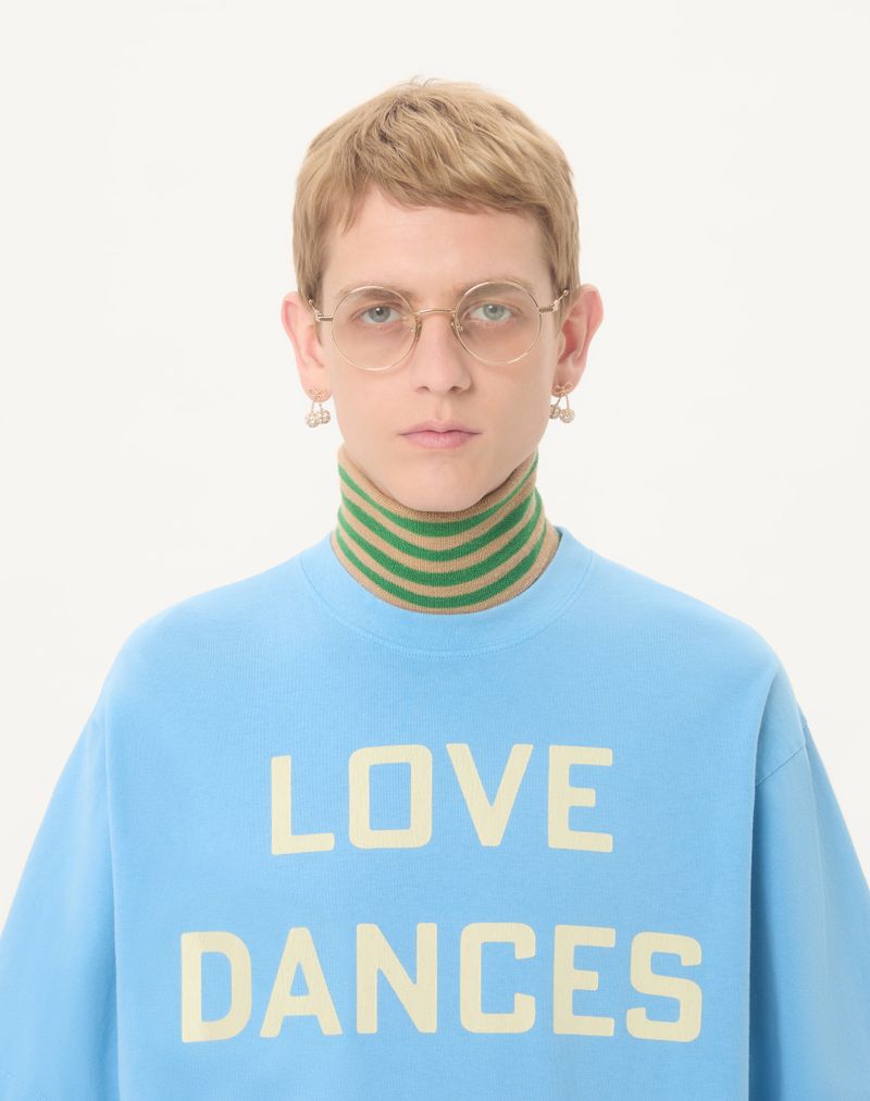 Valentino katoenen T-shirt met print 'Love Dances On The Abyss' en 'Made In Valentino'.