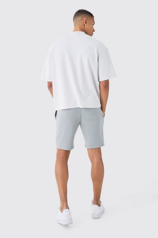 Kastige Oversize Shorts mit Homme-Print