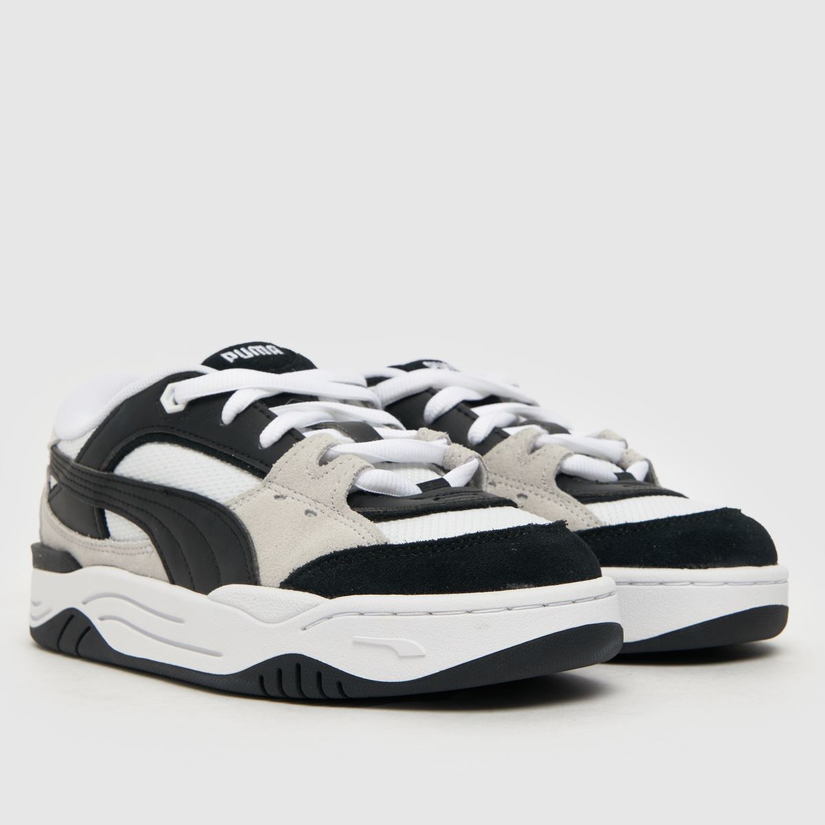 PUMA svarta och vita 180 Youth-träningsskor