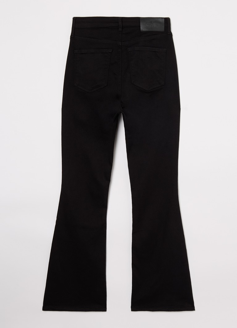Jeans Calvin Klein a vita alta e gamba svasata con lavaggio colorato