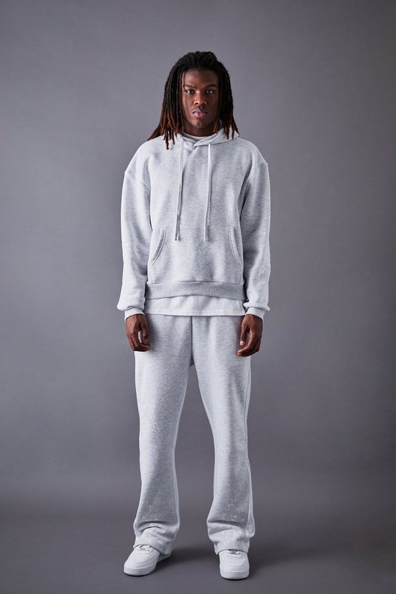 Kastiger Oversize Man Dash Trainingsanzug mit Farbspritzern