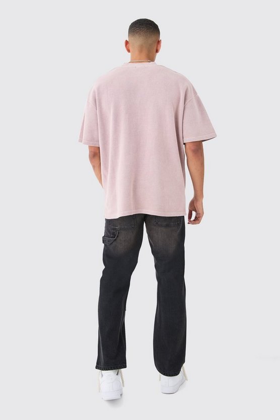 Lockere Jeans in gewaschenem Schwarz mit Riss am Knie