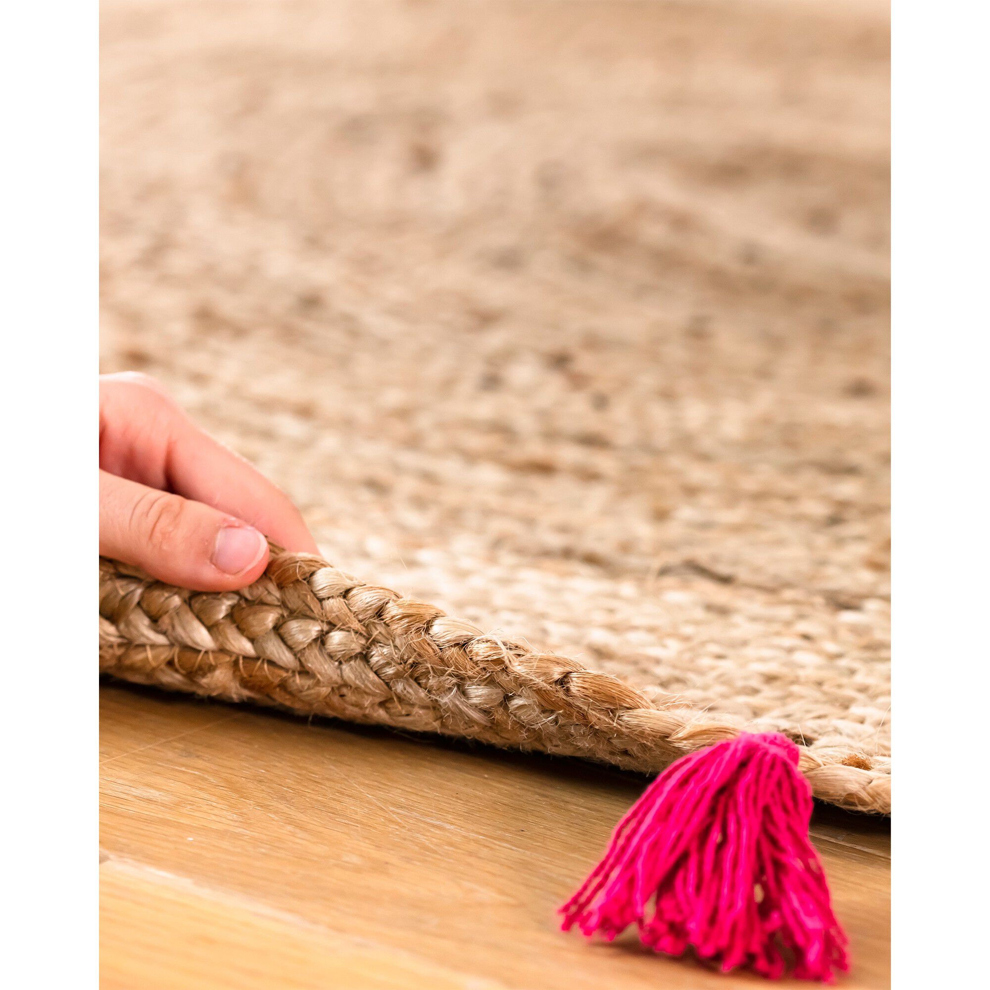 Tapis rond en jute avec pompons de couleur