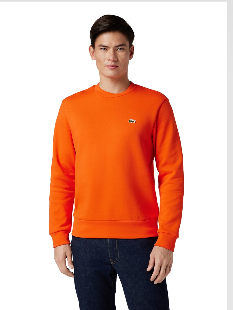 Sweatshirt in unifarbenem Design mit Label-Stitching in orange