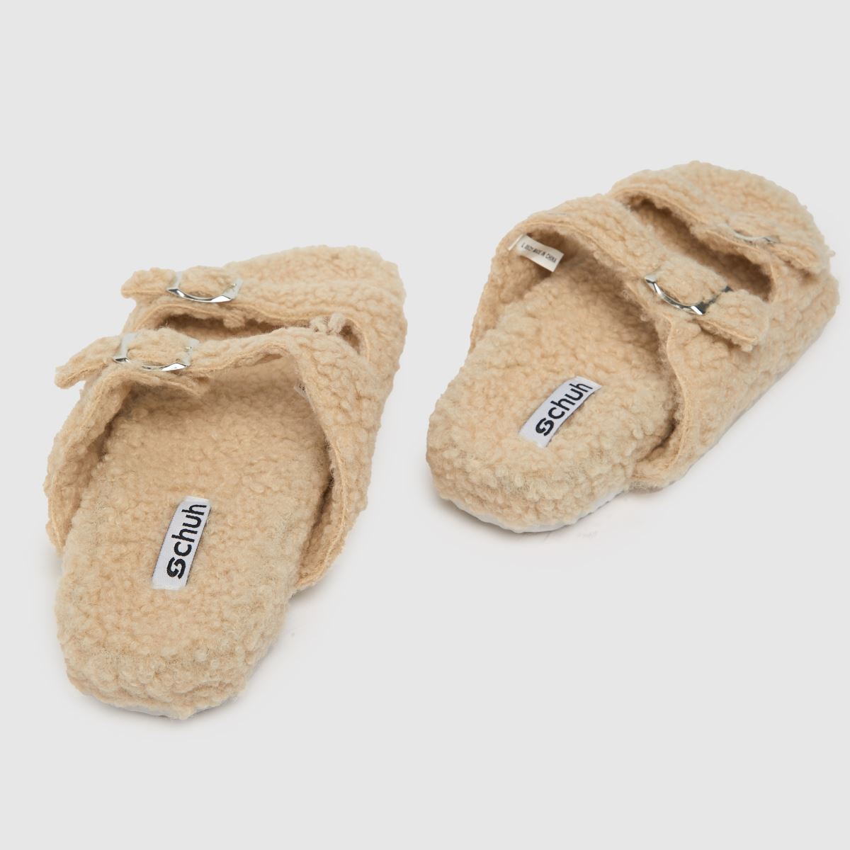 Schuh Haven – Beige tofflor med borgspänne