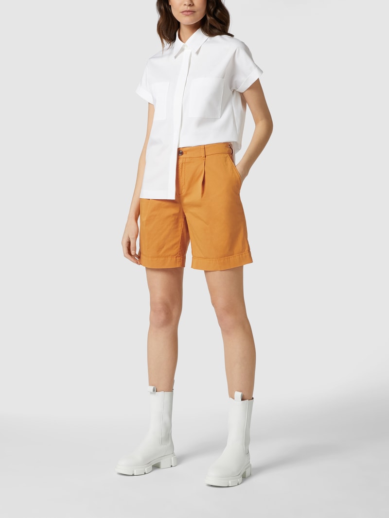 Bermudas mit französischen Eingrifftaschen in orange