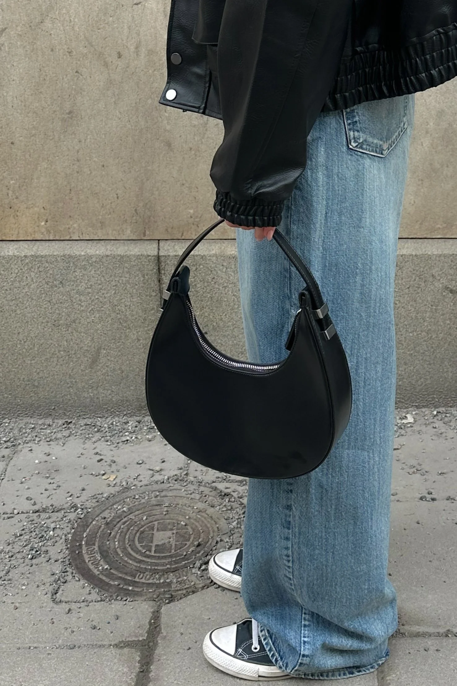 Glänzende abgerundete Tasche