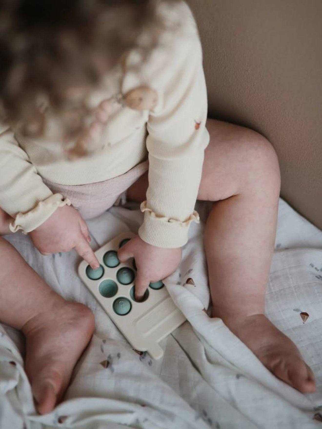 Mushie Baby Greifspielzeug MUSHIE, Pop-it Telefon - rosa
