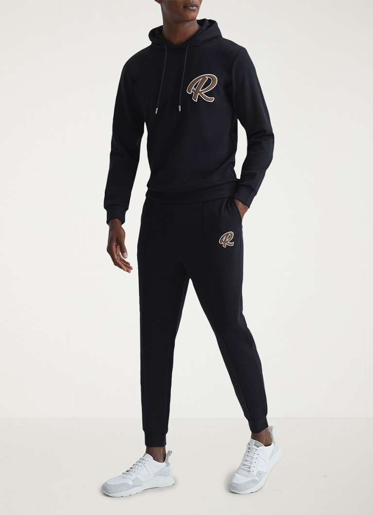 Pantaloni de trening conici Reiss Premier cu buzunare laterale.