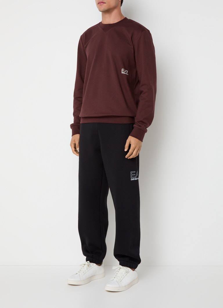 Pantaloni de trening slim fit de la Emporio Armani, cu logo și buzunare laterale.