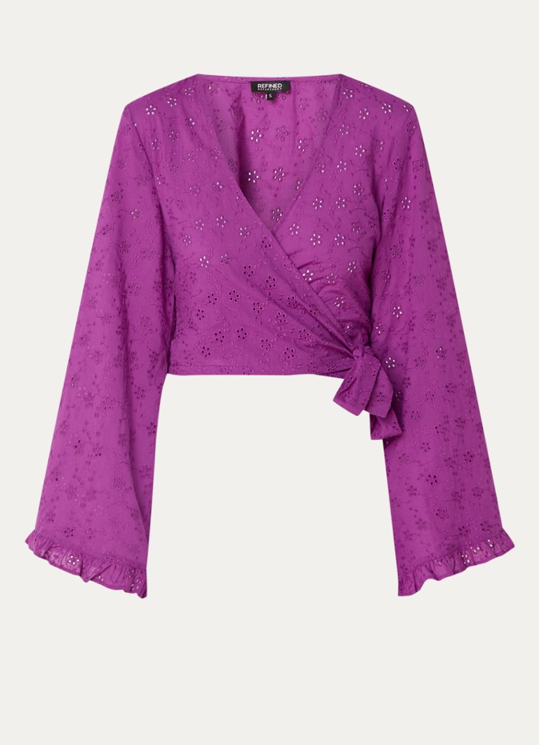 Elegante top avvolgente con ricami.