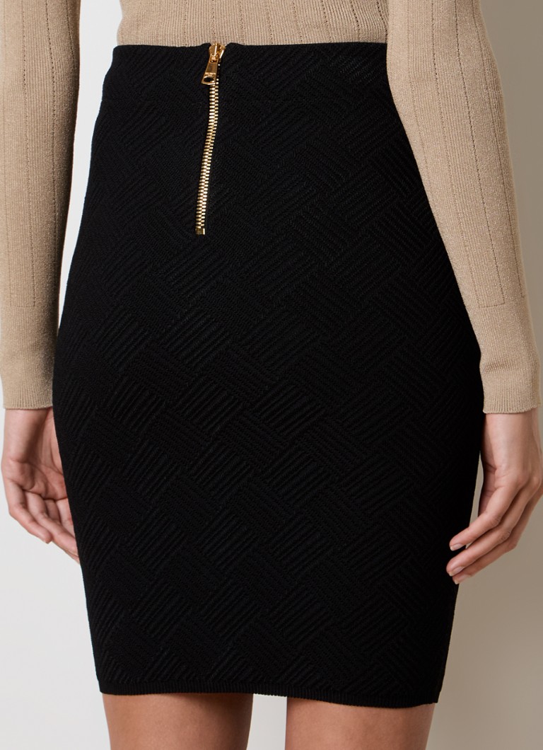 Gonna corta a tubino Balmain in maglia grossa con bottoni decorativi.