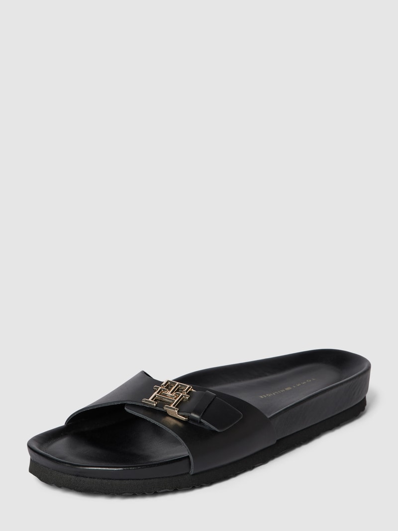 Pantoletten mit Label-Applikation in metallic Modell 'MULE' in schwarz