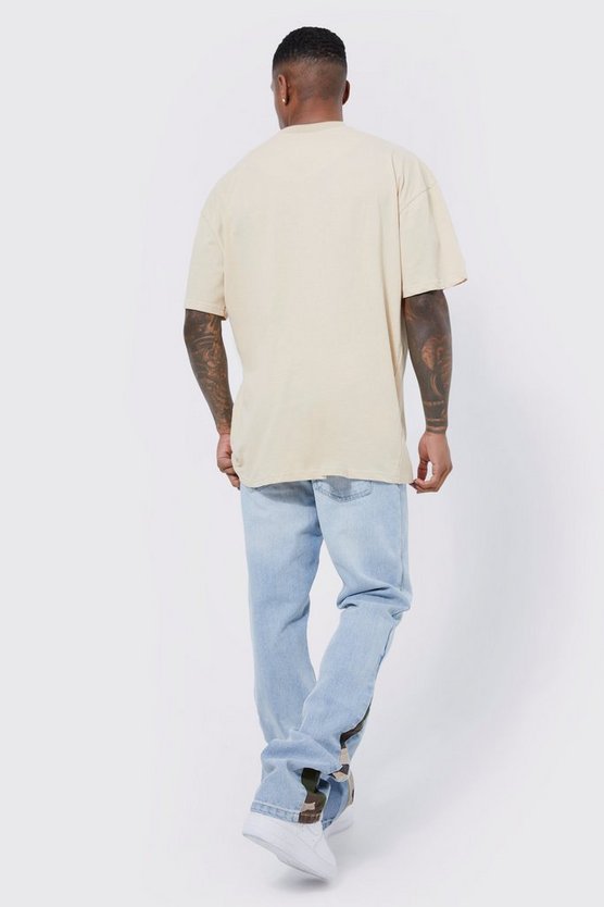 Slim-Fit Schlagjeans mit Camouflage-Detail