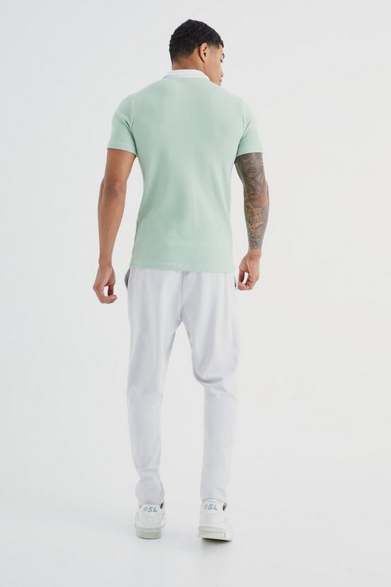 Kurzärmliges Muscle-Fit Poloshirt in Waffeloptik
