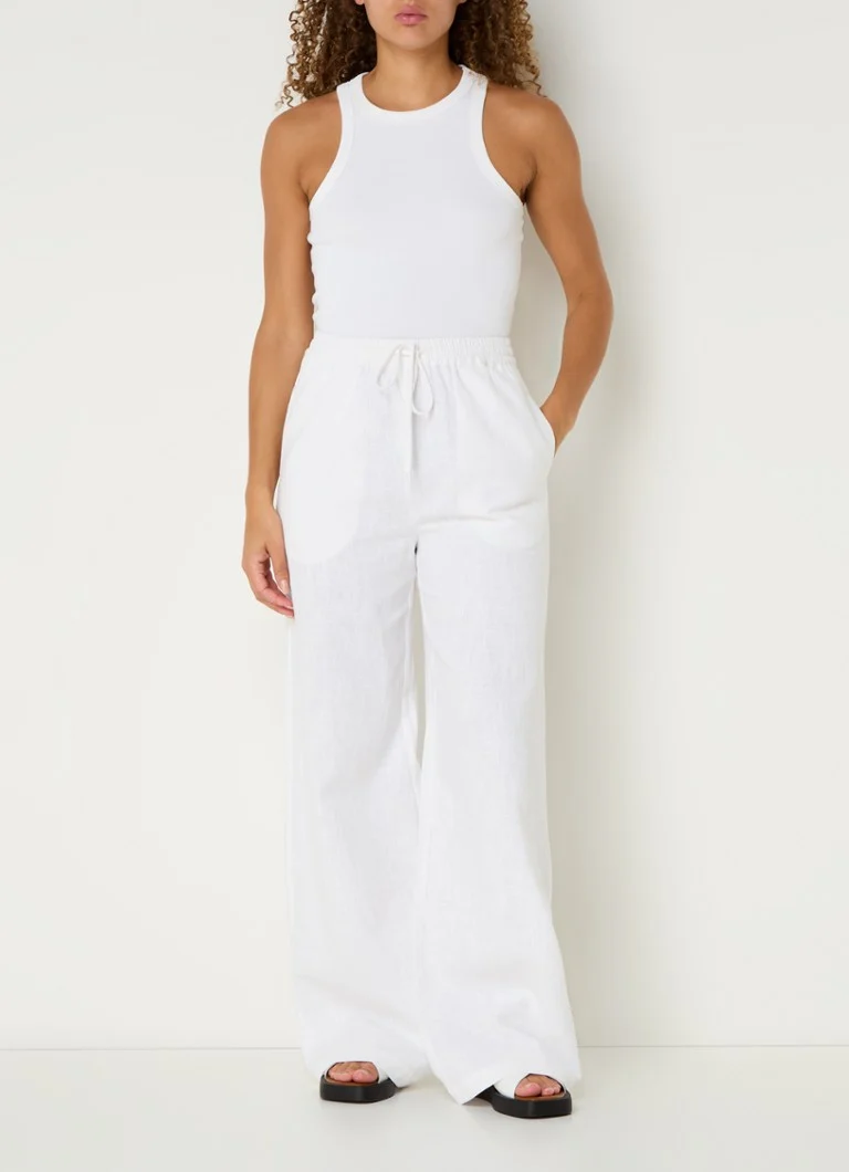 Pantaloni palazzo a vita alta e gamba larga modello Loise di Co'Couture, in lino