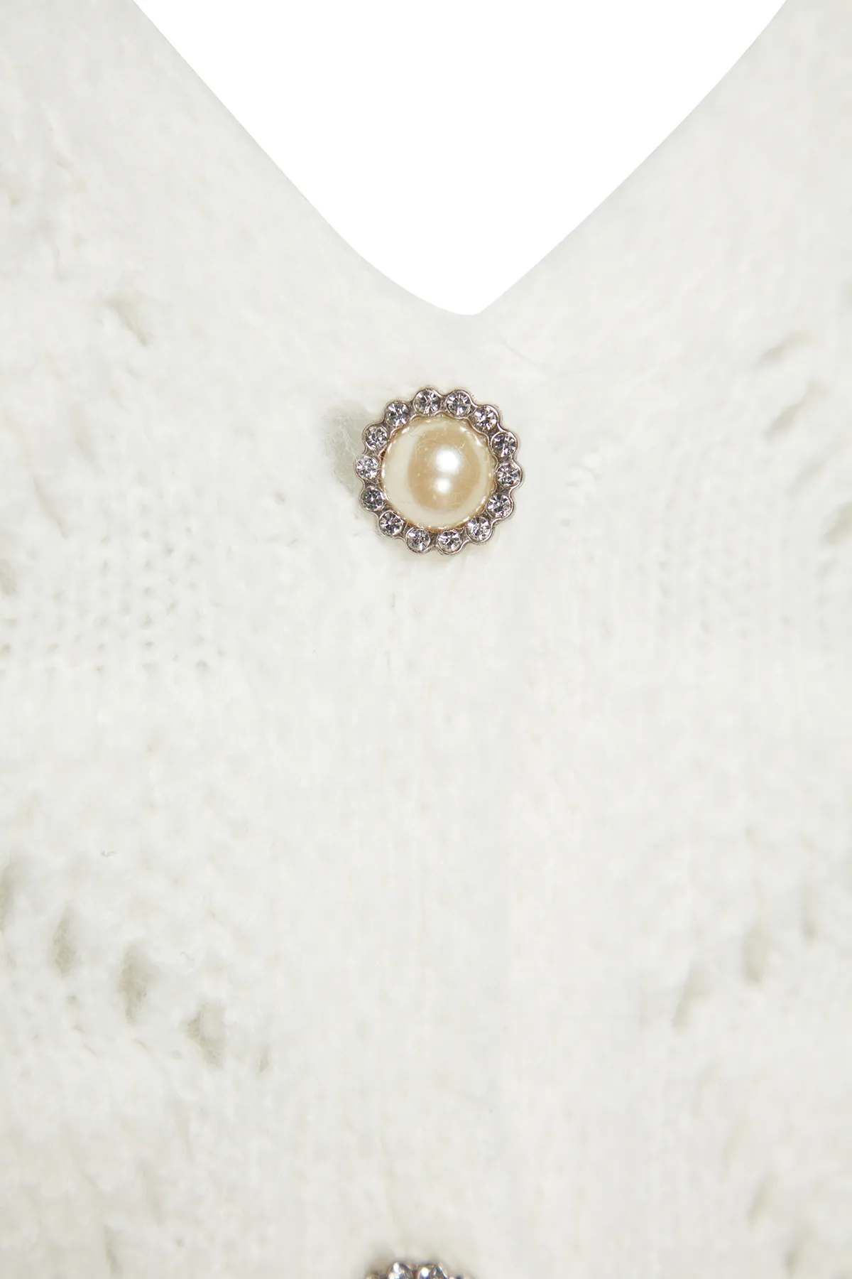 Trendyol Collection  Ecrufarbene Strickjacke mit Lochmuster TWOAW24HI00311