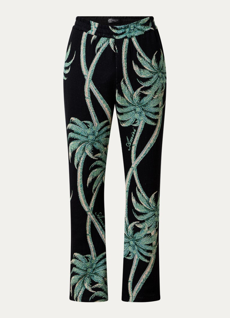 AMIRI Flared trousers with tropical print